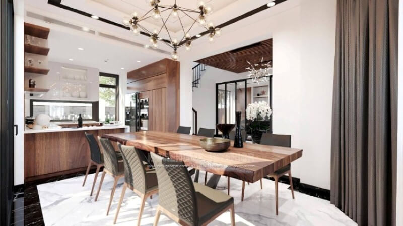 Ngoài điểm đặc biệt từ cách bố trí kệ trang trí, bàn đảo bằng đá nhân tạo LG màu trắng được thiết kế phô ra ngoài lại là điểm đáng chú ý, một mặt vẫn đảm bảo diện tích để chủ nhân có thể trưng bày món ăn thỏa mái, một mặt bạn lại có thể vừa nội trợ vừa có thể trông nom con học một cách dễ dàng.  Tủ bếp gỗ công nghiệp và tủ bếp acrylic