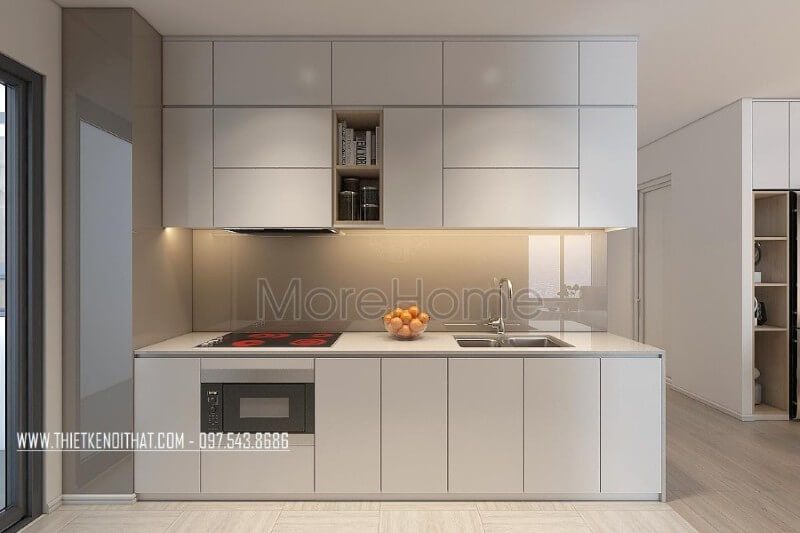 Mẫu tủ bếp kiểu dáng chữ i gỗ acrylic màu trắng kết hợp phân chia các ngăn tủ một cách hợp lí, tạo cho người nội trợ thuận tiện hơn trong quá trình mang lại những bữa cơm ngon miệng cho những người thân yêu của mình