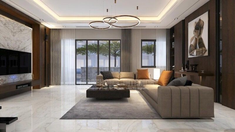 Với không gian rộng lớn, việc thế kế đòi hỏi phải làm sao để nó mang lại cảm giác gần gũi, Morehome xin gợi ý ý tưởng trong trang trí nội thất biệt thự Park city trong đây, phòng khách với tone màu trầm kết hợp cách trang trí khéo léo từ tấm gỗ ốp tường, tranh canvas, sofa góc, đá đối vân trang trí.